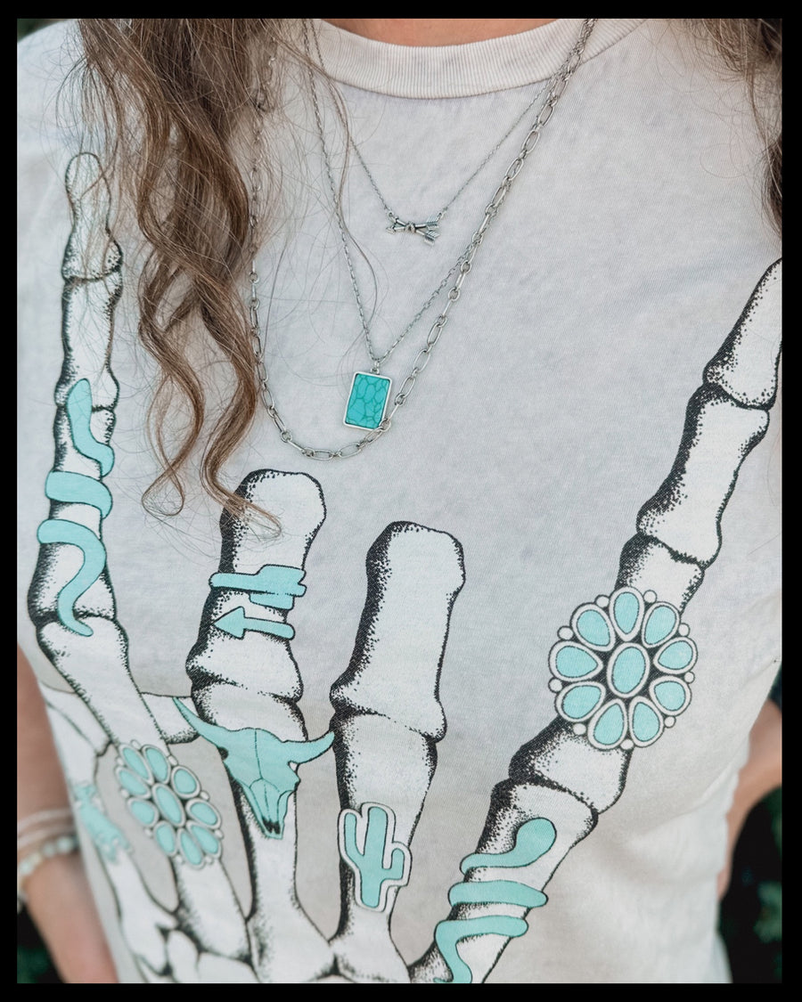 Turquoise Skeleton Hand Graphic Tee